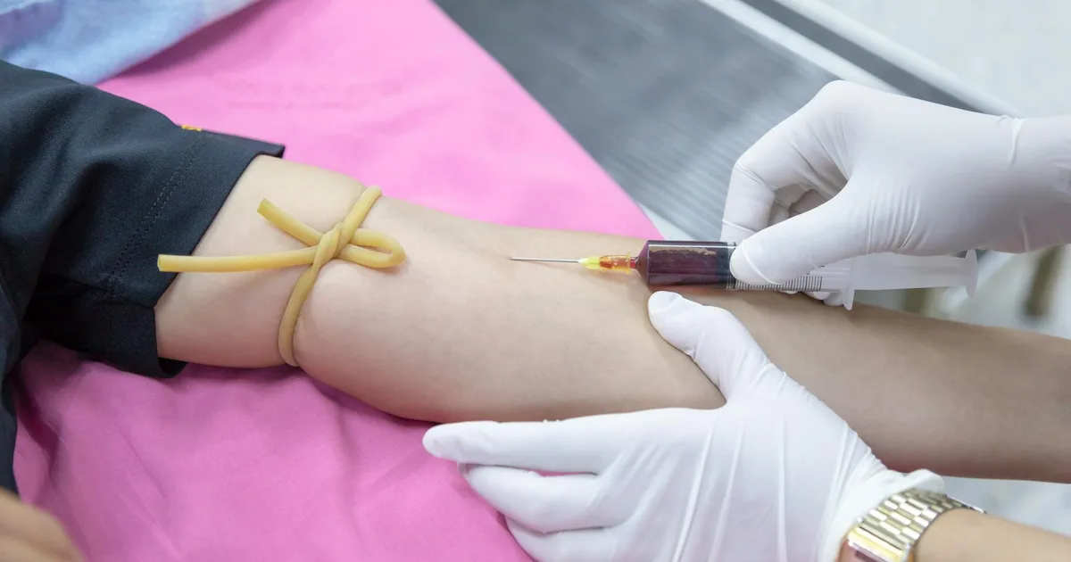 Medical professional performing a blood draw